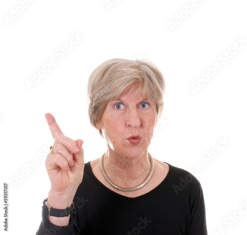 Photo: Seniorin hebt Zeigefinger Seniorin hebt Zeigefinger