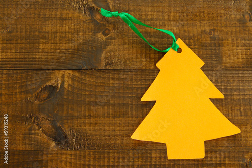Photo: Orange label on wooden background Orange label on wooden background