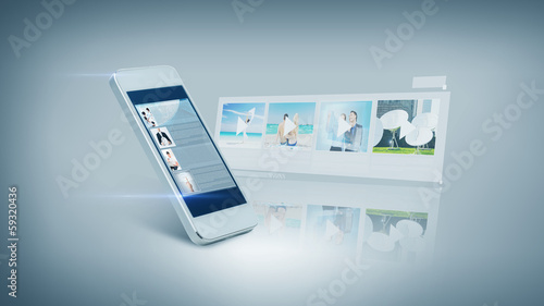 Photo: white smarthphone with video on screen white smarthphone with video on screen