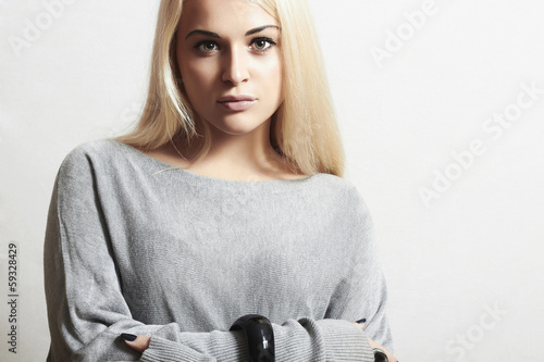 Photo: Beautiful blond woman in dress.fashion model girl.modest Beautiful blond woman in dress.fashion model girl.modest