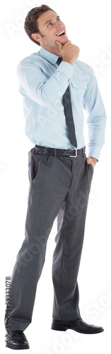 Photo: Thoughtful businessman with hand on chin Thoughtful businessman with hand on chin