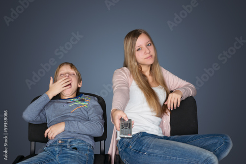 Photo: Boy and girl watching TV Boy and girl watching TV