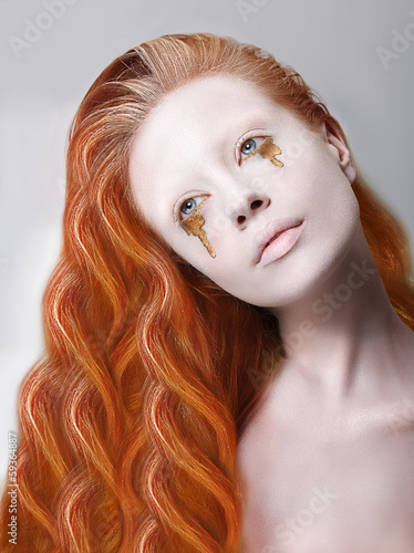 Photo: Harlequin. Artistic Woman with Painted Face and Creative Makeup Harlequin. Artistic Woman with Painted Face and Creative Makeup