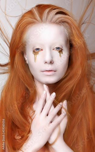 Photo: Masquerade. Redhead Woman with Futuristic Make-up. Fantasy Masquerade. Redhead Woman with Futuristic Make-up. Fantasy