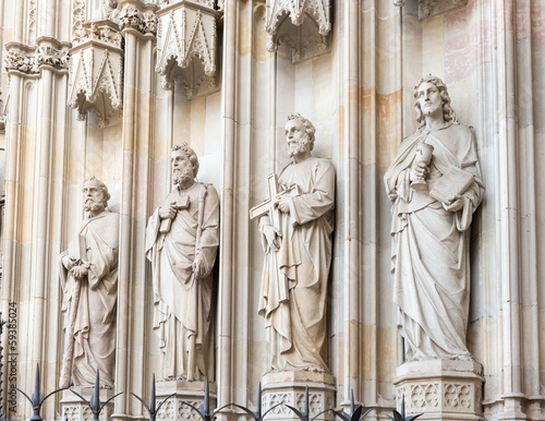 Photo: Statues at the entrance into cathedral in Barcelona, Spain. Statues at the entrance into cathedral in Barcelona, Spain.