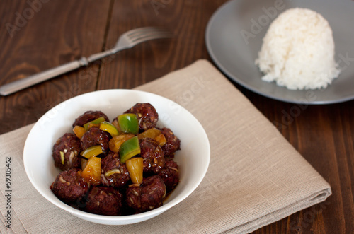 Photo: sweet and sour meatballs with pineapple chunks and white rice sweet and sour meatballs with pineapple chunks and white rice