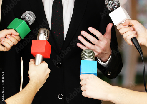 Photo: Conference meeting microphones and businessman Conference meeting microphones and businessman