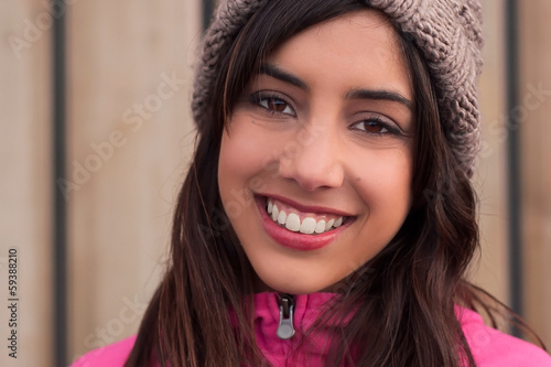 Photo: Closeup of young woman with beanie Closeup of young woman with beanie