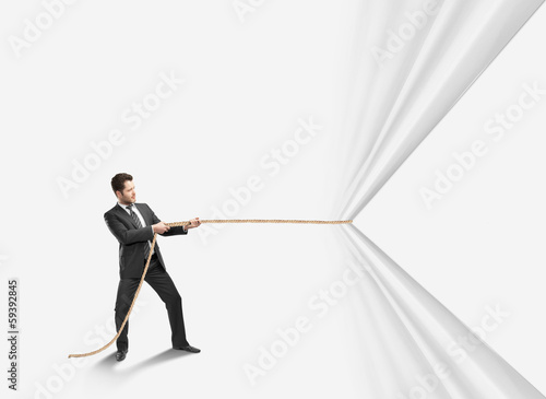 Photo: man pulling rope man pulling rope