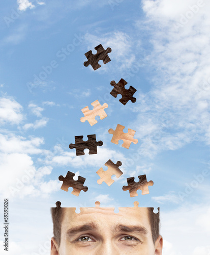 Photo: head man built of puzzle head man built of puzzle