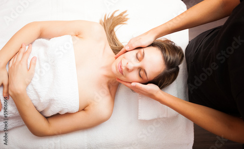 Photo: Woman having a massage Woman having a massage