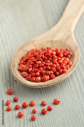 Photo: red pepper in a wooden spoon red pepper in a wooden spoon