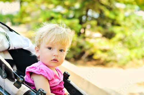 Photo: baby girl in stroller baby girl in stroller