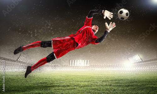 Photo: Goalkeeper catches the ball Goalkeeper catches the ball