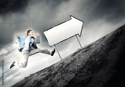 Photo: Businessman running on the road Businessman running on the road