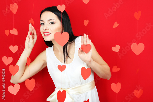 Photo: Attractive young woman on Valentine Day Attractive young woman on Valentine Day