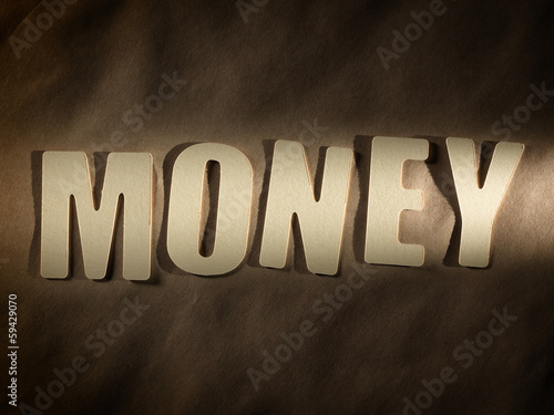 Photo: The word Money on paper background The word Money on paper background