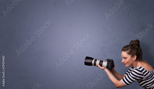 Photo: Photographer shooting images with copyspace area Photographer shooting images with copyspace area