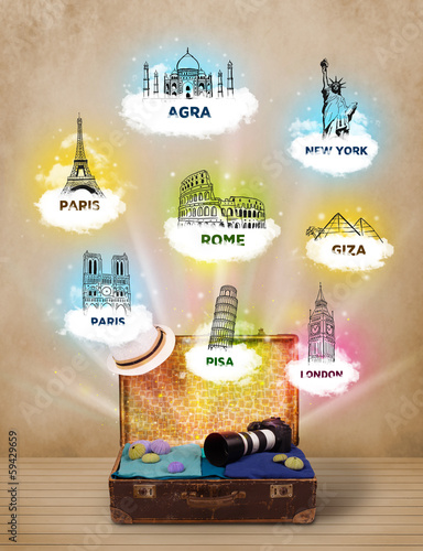 Photo: Tourist suitcase with famous landmarks around the world Tourist suitcase with famous landmarks around the world