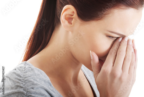 Photo: Beautiful woman touching her nose. Beautiful woman touching her nose.