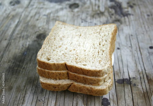 Photo: wheat bread on wooden wheat bread on wooden