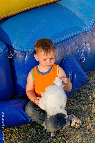 Photo: Small boy eating a portion of candy floss Small boy eating a portion of candy floss