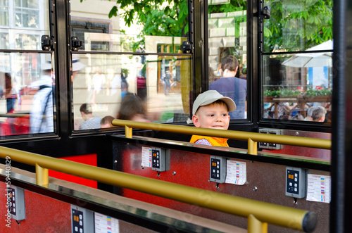 Photo: Small boy in a sightseeing tram or coach Small boy in a sightseeing tram or coach