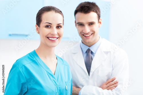 Photo: Friendly Male and Female Doctors Friendly Male and Female Doctors