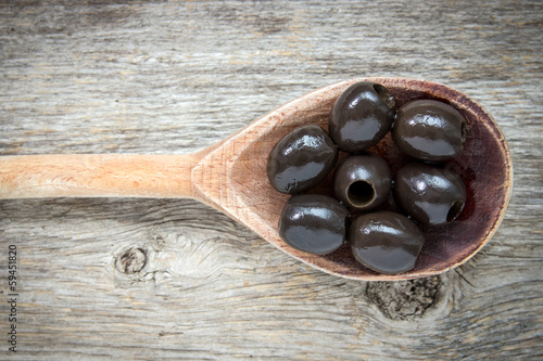 Photo: Spoon with olives Spoon with olives