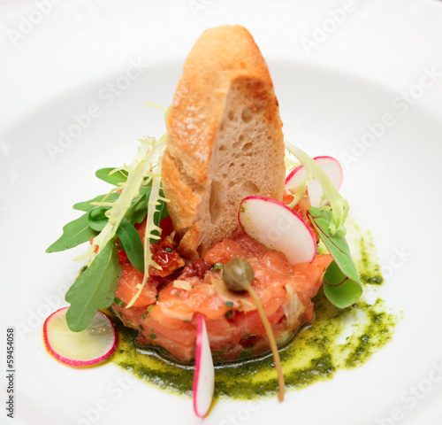 Photo: Salmon carpaccio in plate close-up Salmon carpaccio in plate close-up