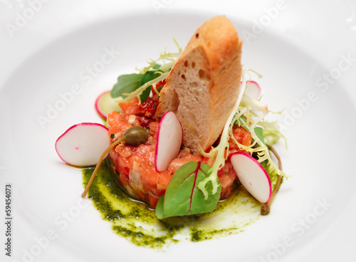Photo: Salmon carpaccio in plate close-up Salmon carpaccio in plate close-up