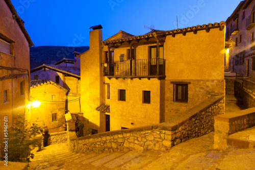 Photo: Narrow street of old spanish village in summer night Narrow street of old spanish village in summer night