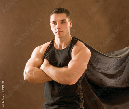 Photo: Sportsman isolated on brown. Sportsman isolated on brown.
