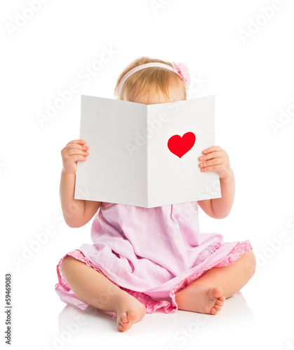 Photo: beautiful baby girl with cute valentine postcard with a red hear beautiful baby girl with cute valentine postcard with a red hear