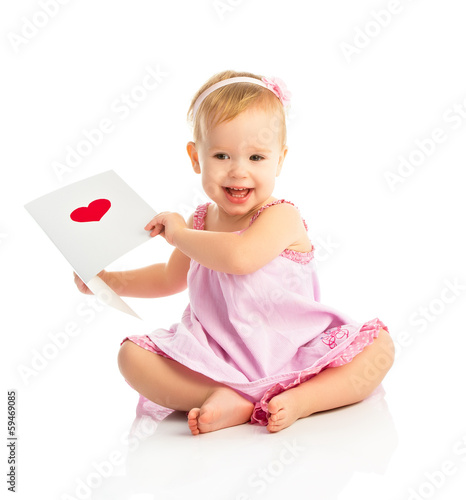 Photo: beautiful baby girl with cute valentine postcard with a red hear beautiful baby girl with cute valentine postcard with a red hear