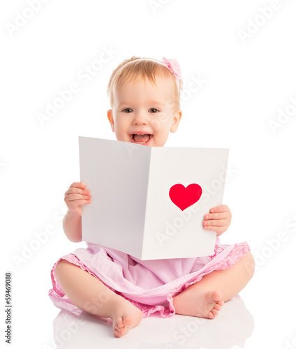 Photo: beautiful baby girl with cute valentine postcard with a red hear beautiful baby girl with cute valentine postcard with a red hear