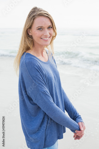 Photo: Portrait of a smiling casual woman at beach Portrait of a smiling casual woman at beach