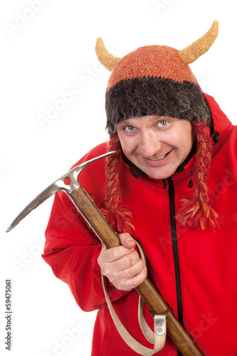 Photo: Funny man holding climbing pickaxe and smiling Funny man holding climbing pickaxe and smiling