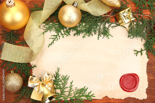 Photo: Frame with vintage paper and Christmas decorations Frame with vintage paper and Christmas decorations