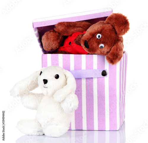 Photo: Textile box with toys, isolated on white Textile box with toys, isolated on white
