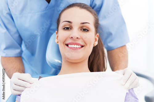 Photo: Young woman at dentist office Young woman at dentist office