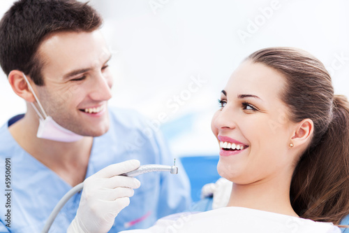 Photo: Male dentist and woman in dentist’s office Male dentist and woman in dentist’s office