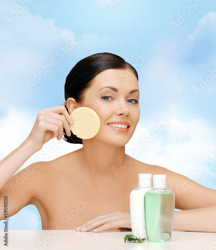 Photo: smiling woman with sponge smiling woman with sponge