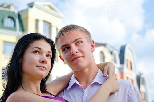 Photo: Young couple with the girl holding her partner Young couple with the girl holding her partner