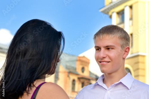 Photo: Attractive blonde man smiling at his girlfriend Attractive blonde man smiling at his girlfriend