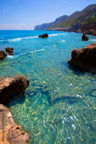 Photo: Denia Alicante Las rotas rocky beach in Spain Denia Alicante Las rotas rocky beach in Spain
