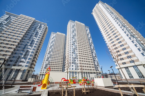 Photo: The three multistoried residential building with a playground The three multistoried residential building with a playground