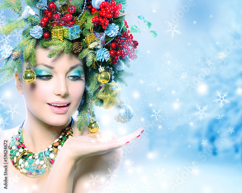 Photo: Christmas Winter Woman with Miracle in Her Hand Christmas Winter Woman with Miracle in Her Hand