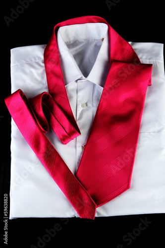 Photo: tie on shirt isolated on black tie on shirt isolated on black