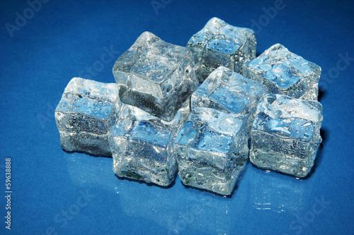 Photo: Ice cubes on color background Ice cubes on color background